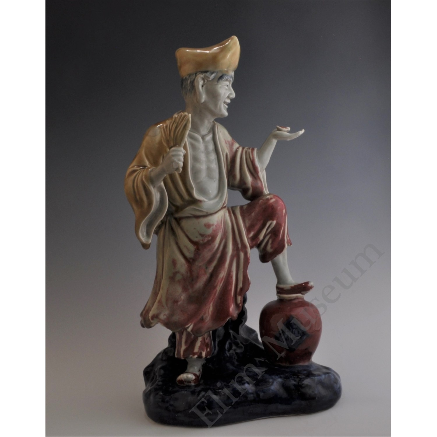 1657 Blue-and-white and underglaze-red figure of a monk