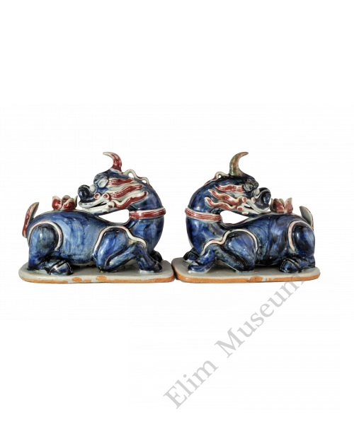 1658 A blue-and-white and underglaze-red xiezhi and lotus sculpture
