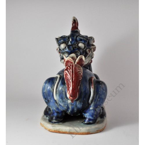 1658 An under glaze B&R statue of Chinese ancient "legal beast" with lotus 