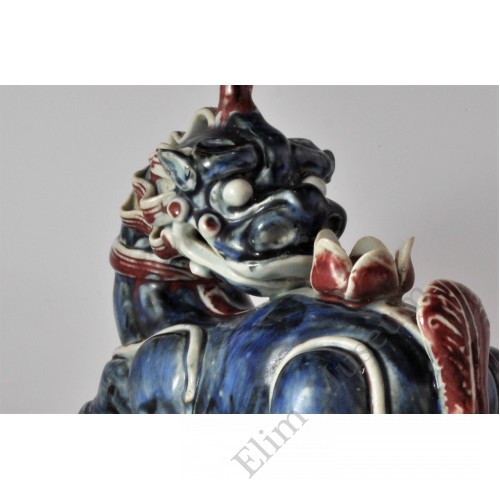 1658 An under glaze B&R statue of Chinese ancient "legal beast" with lotus 