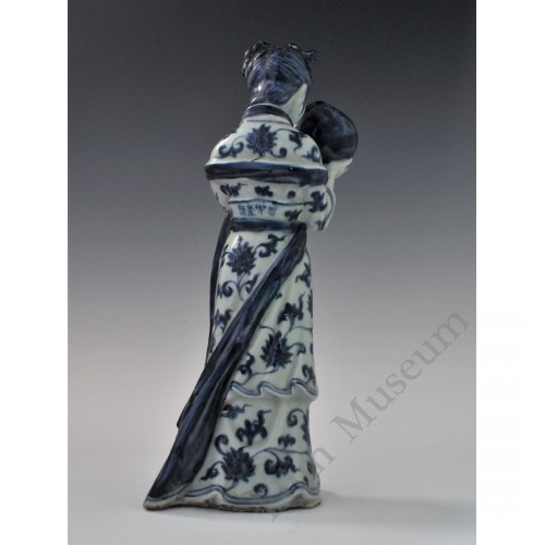 1727  A underglaze blue statue of a Court Maid holding a peach