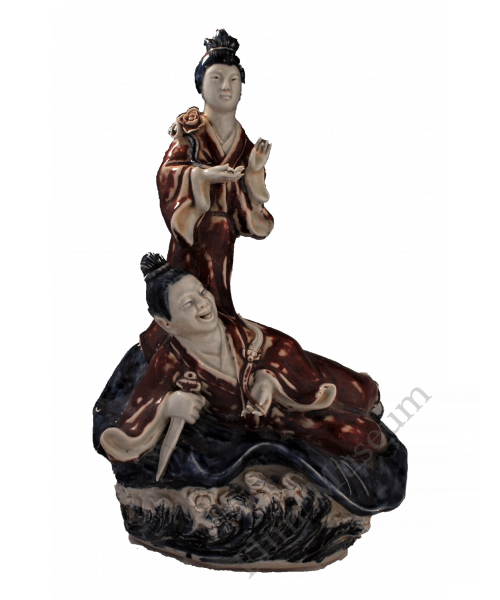 1729 A blue-and-white and underglaze-red sculpture of Lü Dongbin and He Xiangu