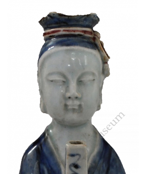 1730 An ewer in the form of a boy holding a scroll, decorated in underglaze blue and red