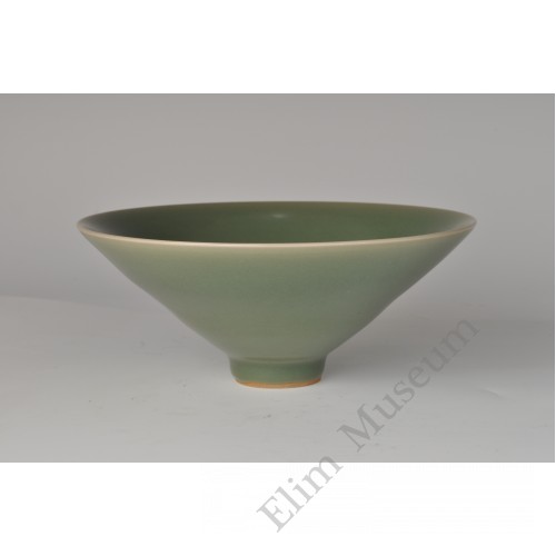 1735 An iridescent green glaze conical bowl 