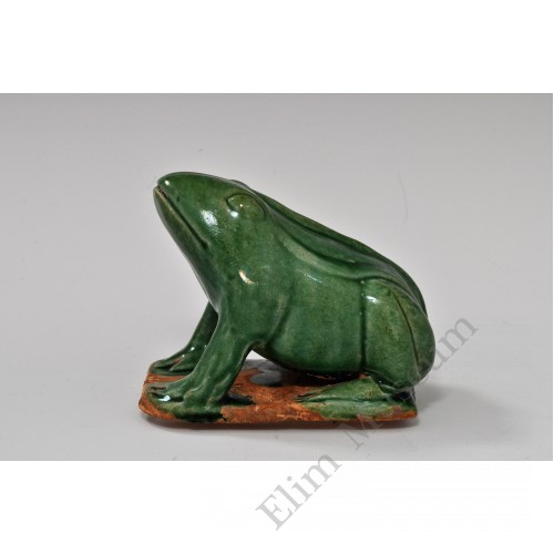 1745 A molded and sculpted green glaze frog   