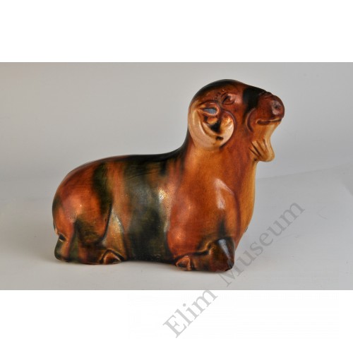 1752 A sculpted Sancai earthware recumbent sheep 