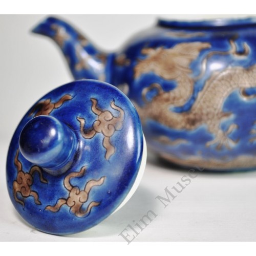 1196  A Kang-Xi sapphire blue engraved teapot 