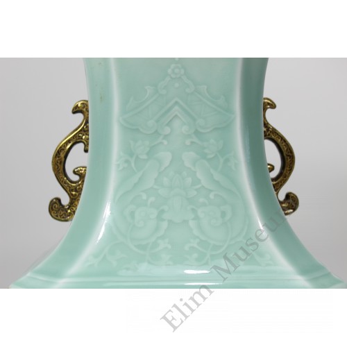 1209  A carved celadon underglaze-blue fencai vase