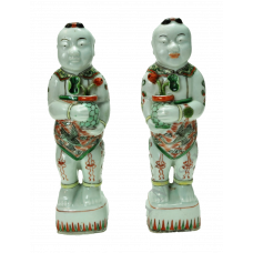 1136 A pair of wucai figures of boys holding lotus flowers