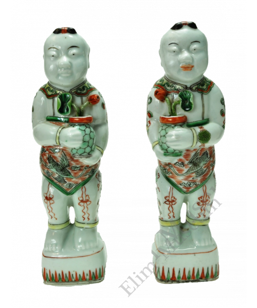 1136 A pair of wucai figures of boys holding lotus flowers